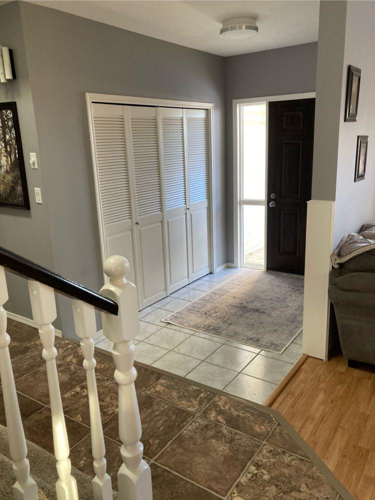 Repainted front entrance trim and walls